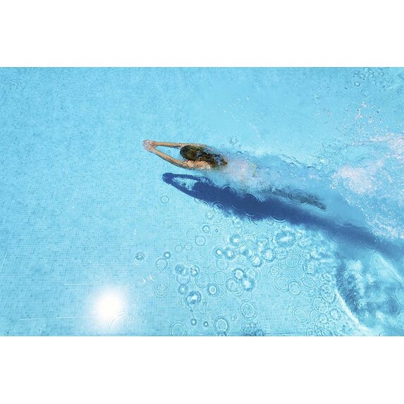 Getty Images Gallery Woman diving in swimming pool by Estend61 via Getty Images Gallery