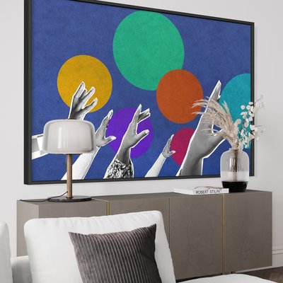 Framed Print on Rag Paper Collage of hands reaching up with colourful dots in background by We Are via Getty Images Gallery
