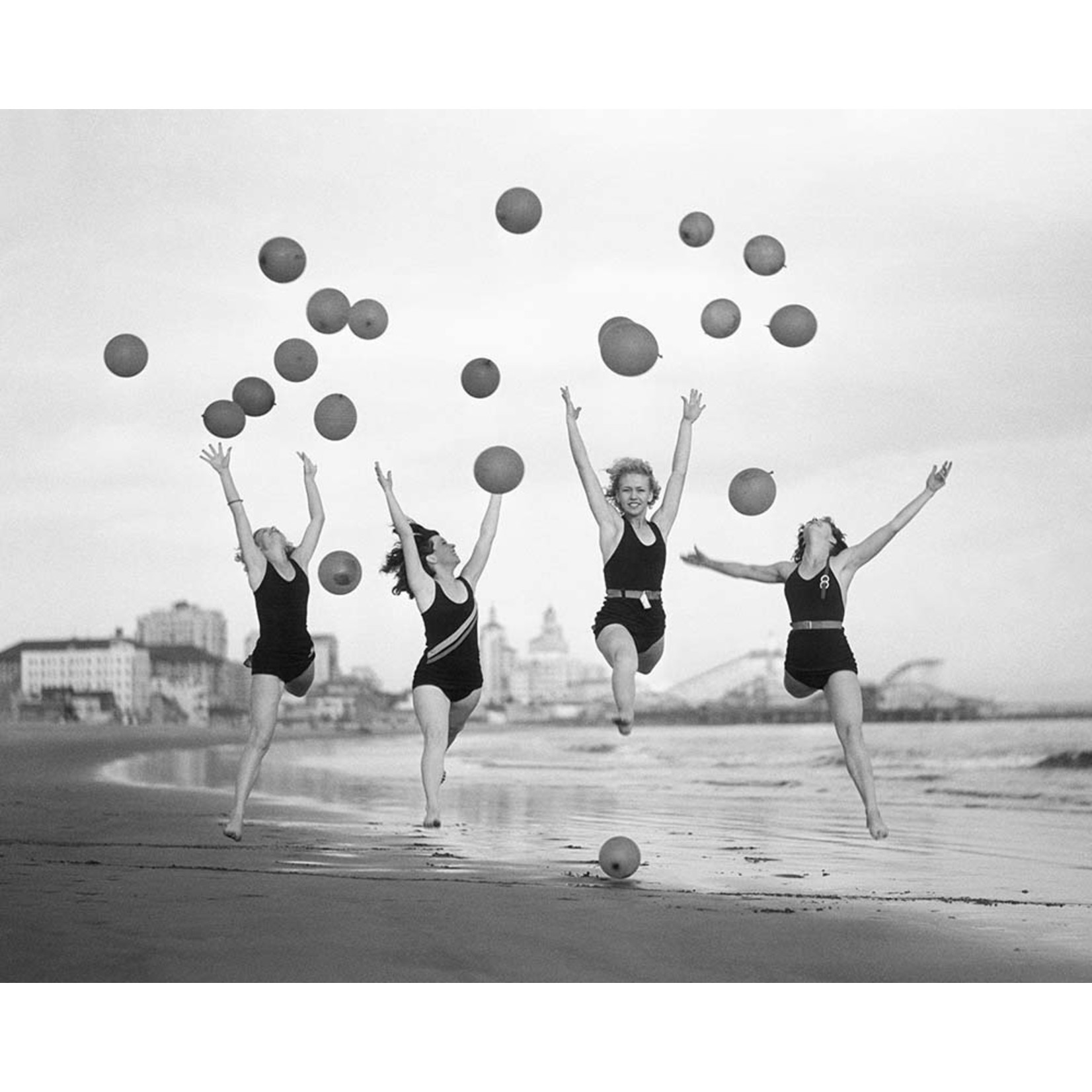 Framed Print on Rag Paper Balloon Dancers on Long Beach by Bettmann via Getty Images Gallery