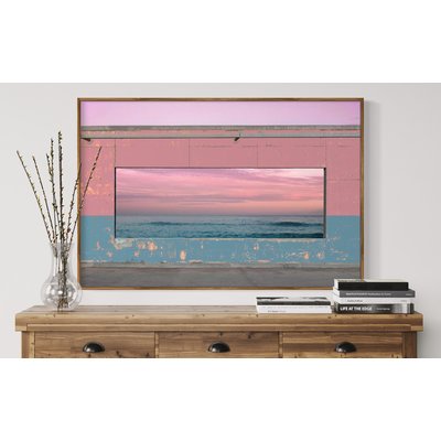 Framed Print on Rag Paper Panoramic window in colorful concrete wall matching with the seascape sunset view by Artur Debat via Getty Images Gallery