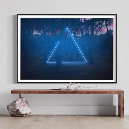 https://www.thepicturalist.com/blue-neon-triangle-light-between-pine-trees.html