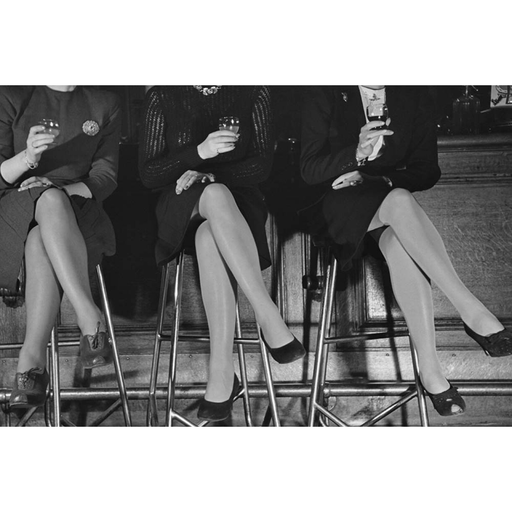 Getty Images Gallery Three pairs of stockinged legs, 1946, Photo by Kurt Hutton