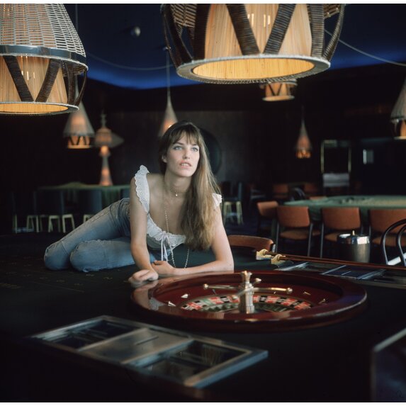 Getty Images Gallery Actress Jane Birkin lying on a roulette table. Photo by Keystone