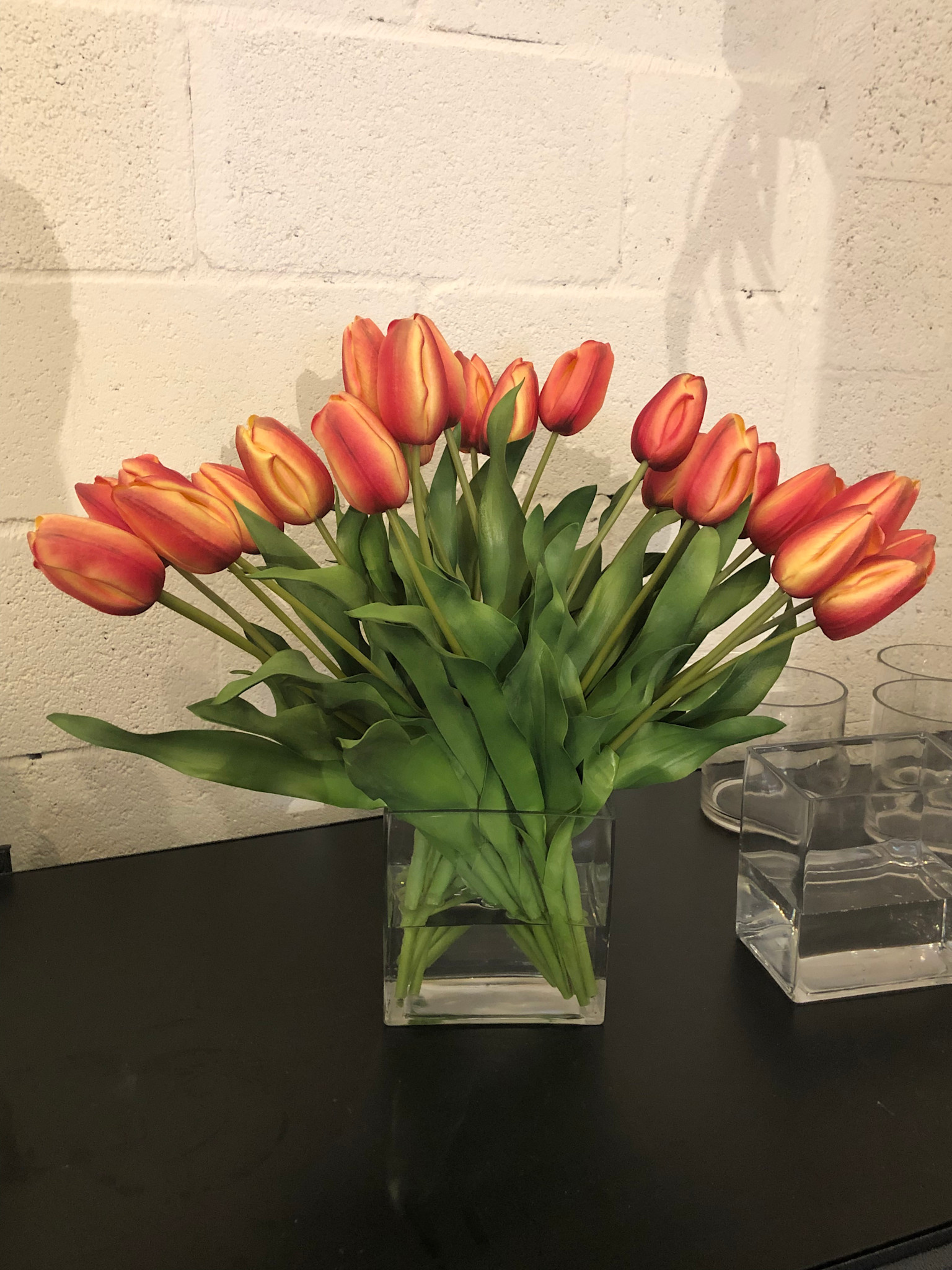 Dutch Tulips in 6” Rectangle Vase (Yellow Orange)