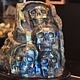 Labradorite 4-Skull Carving in Custom Wood Stand