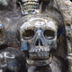 Labradorite 4-Skull Carving in Custom Wood Stand