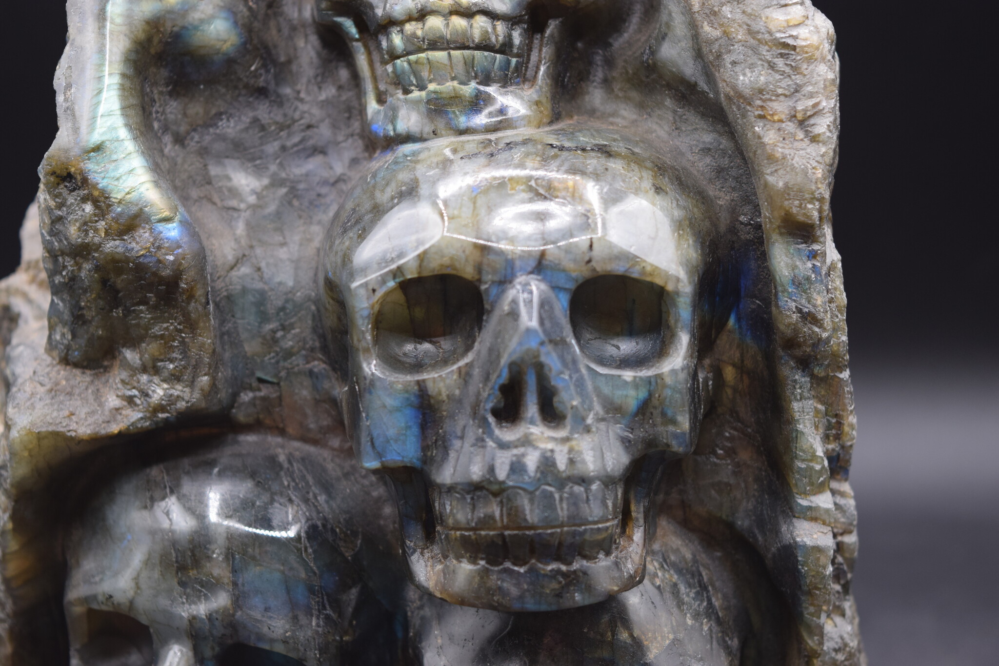 Labradorite 4-Skull Carving in Custom Wood Stand