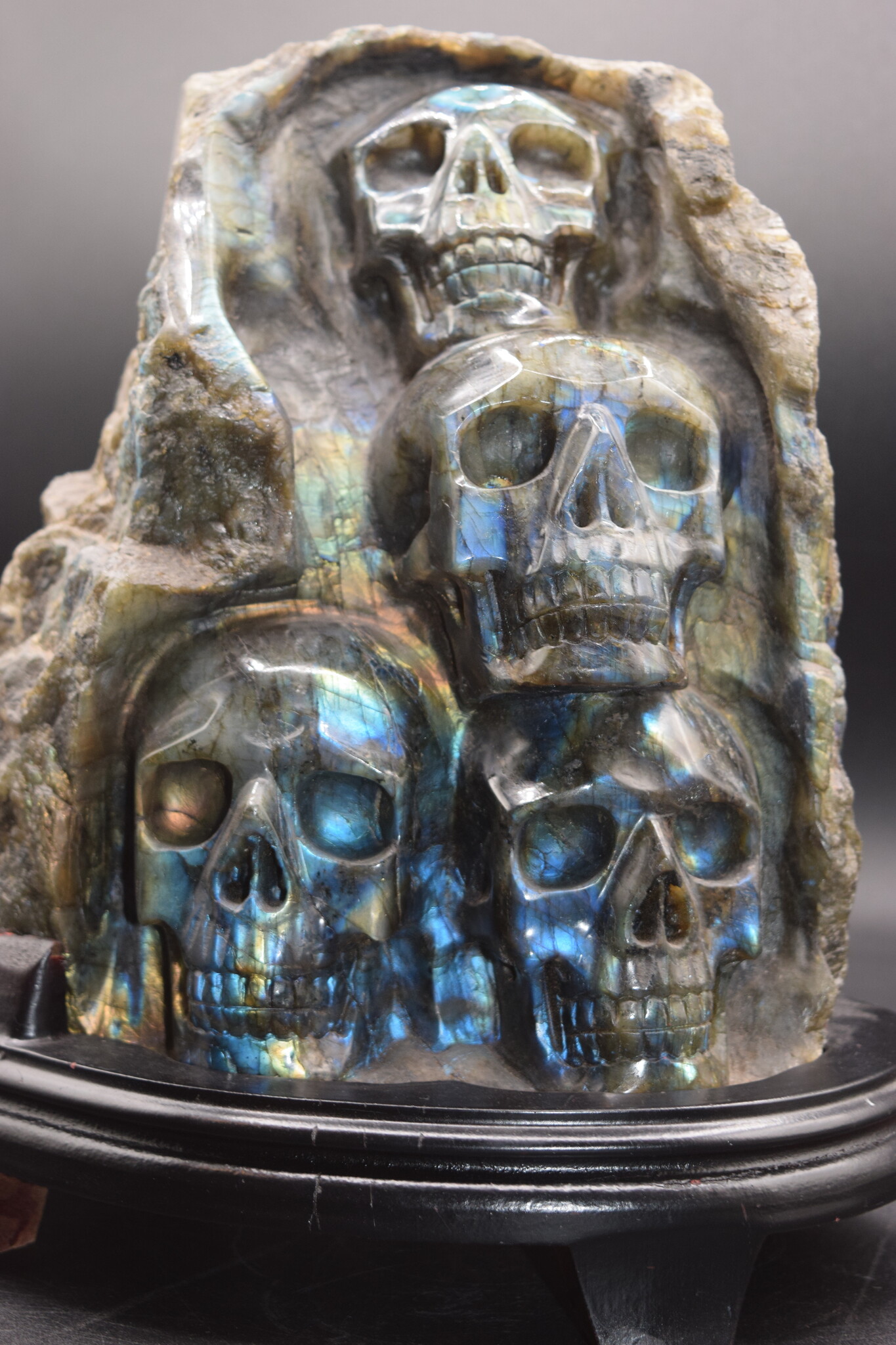 Labradorite 4-Skull Carving in Custom Wood Stand