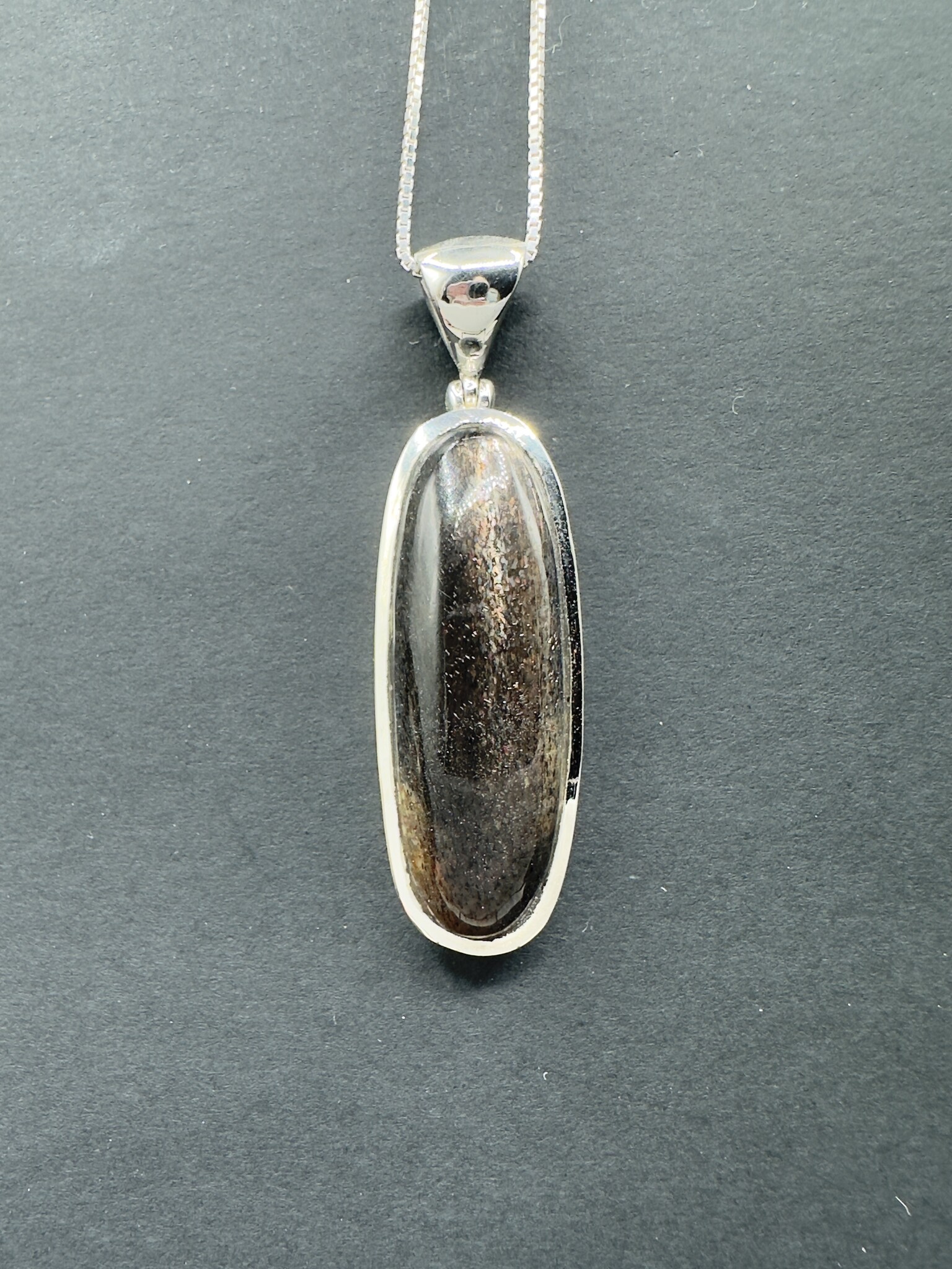 STB 001 SS Black Sunstone 13x39mm Oval Cabochon Bezel Set Pendant With Hinged Bail on 18 " Box Chain Necklace