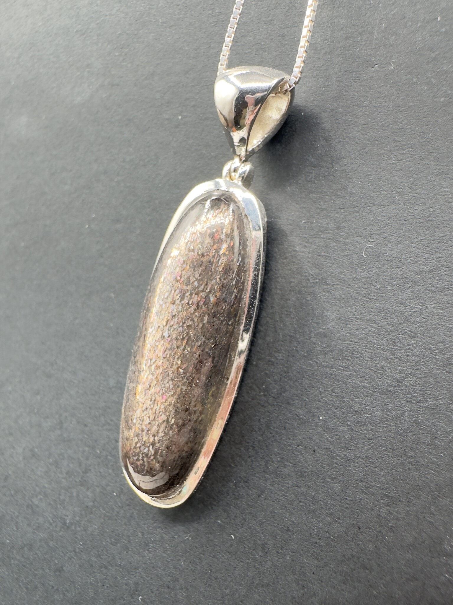 STB 001 SS Black Sunstone 13x39mm Oval Cabochon Bezel Set Pendant With Hinged Bail on 18 " Box Chain Necklace