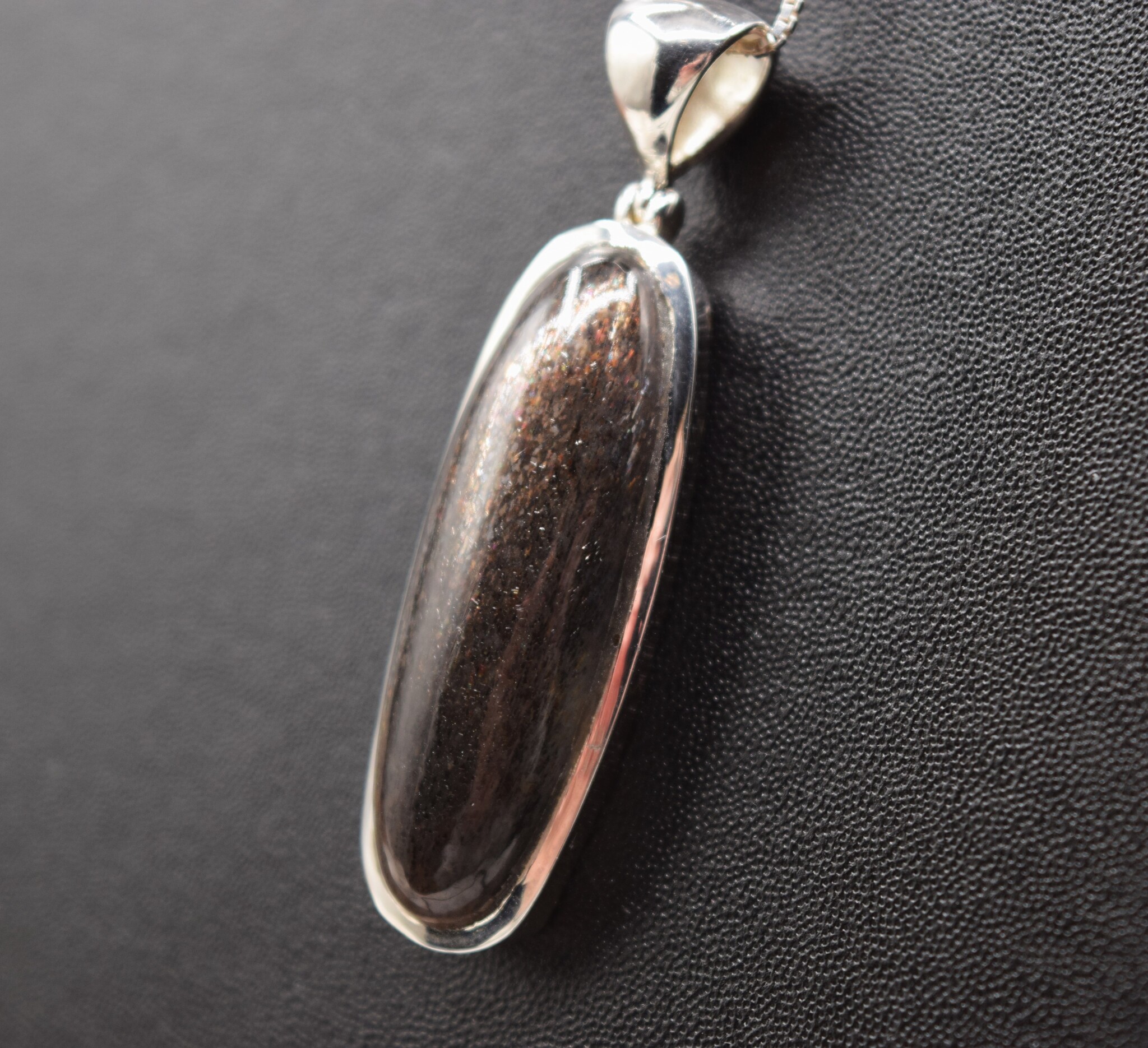 STB 001 SS Black Sunstone 13x39mm Oval Cabochon Bezel Set Pendant With Hinged Bail on 18 " Box Chain Necklace