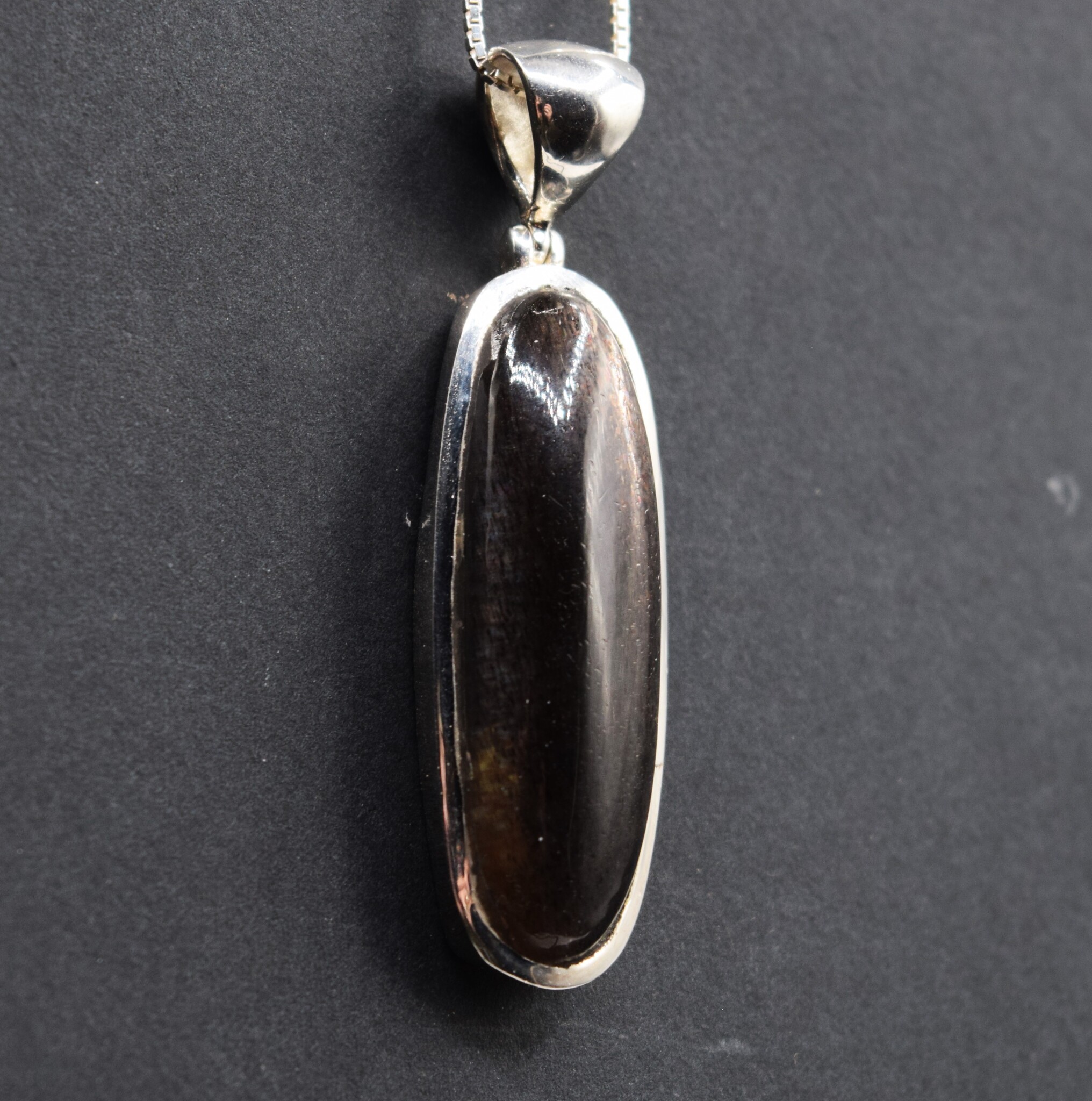 STB 001 SS Black Sunstone 13x39mm Oval Cabochon Bezel Set Pendant With Hinged Bail on 18 " Box Chain Necklace