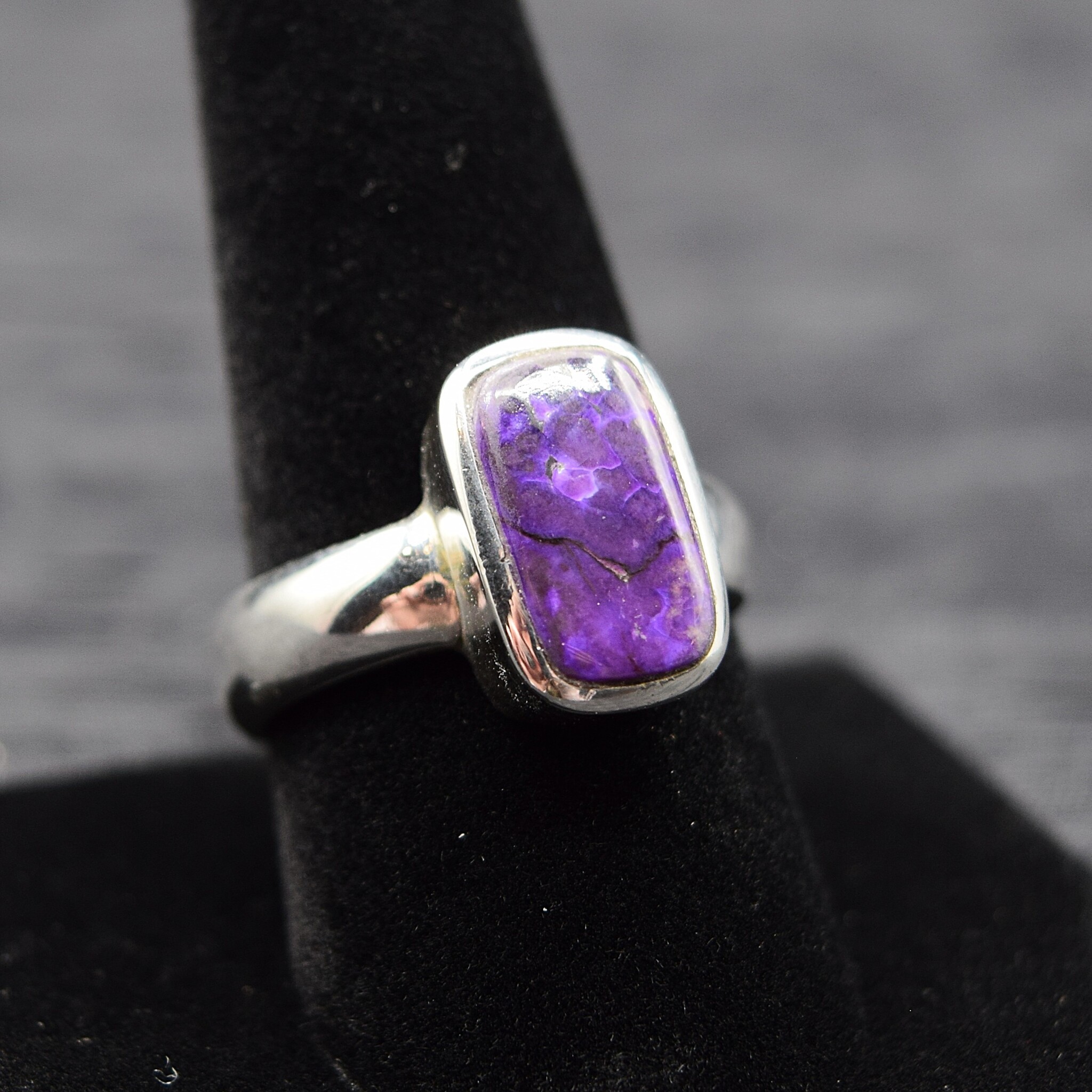 SUG 011 SS Sugilite 8x14mm Rounded Rectangular Cabochon Bezel Set Ring, sz. 10