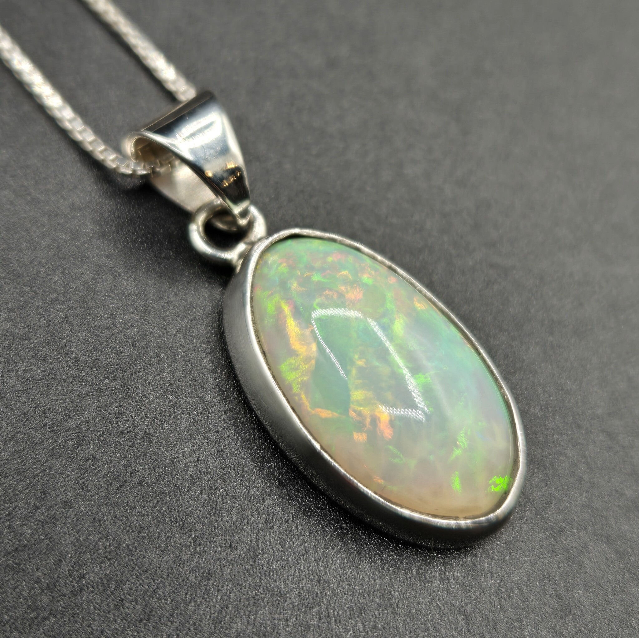 WLM 024 SS Ethiopian Fire Opal 13x19mm Oval Cabochon Bezel Set Pendant With Box Chain Necklace, 18"