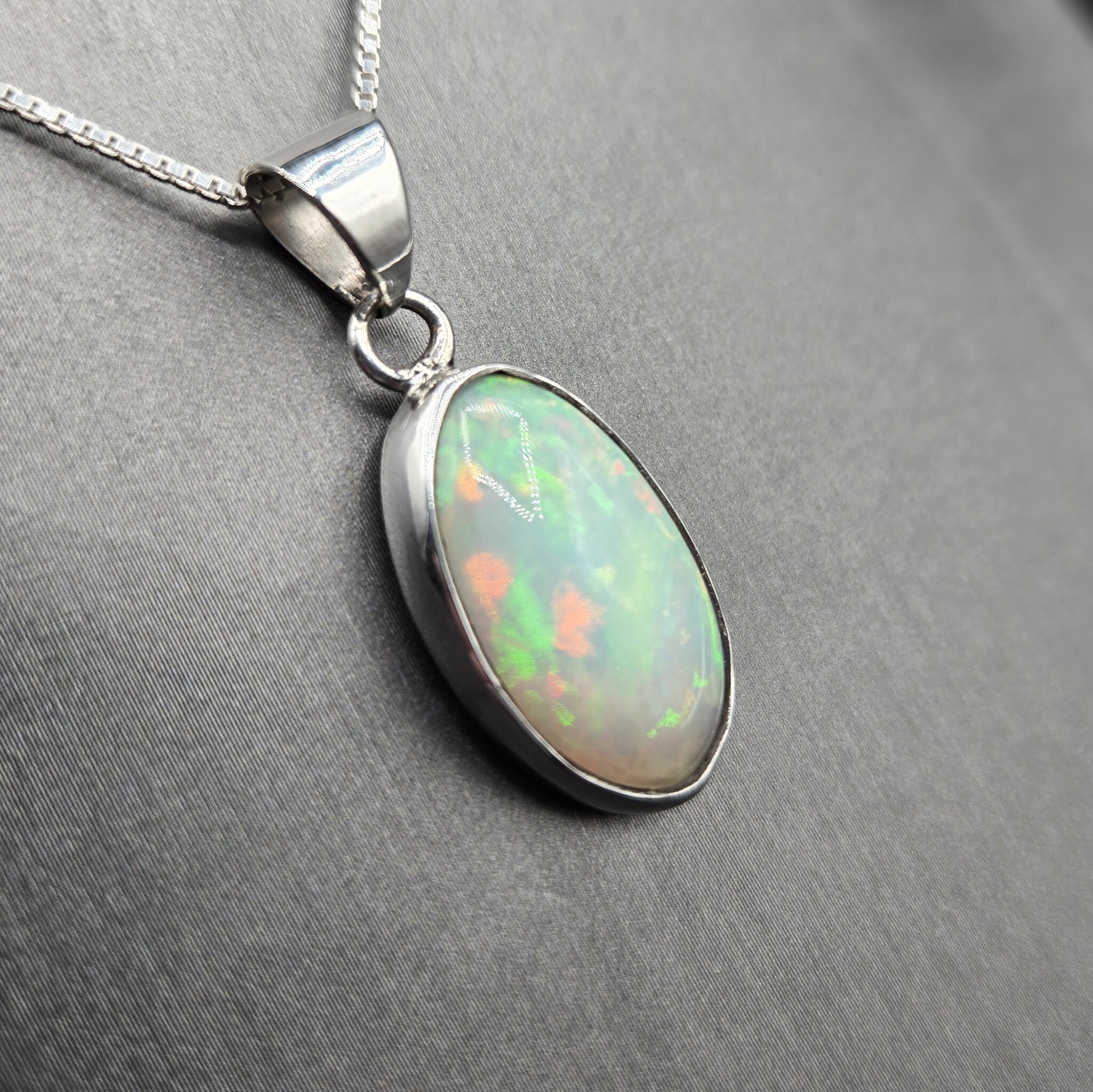 WLM 024 SS Ethiopian Fire Opal 13x19mm Oval Cabochon Bezel Set Pendant With Box Chain Necklace, 18"