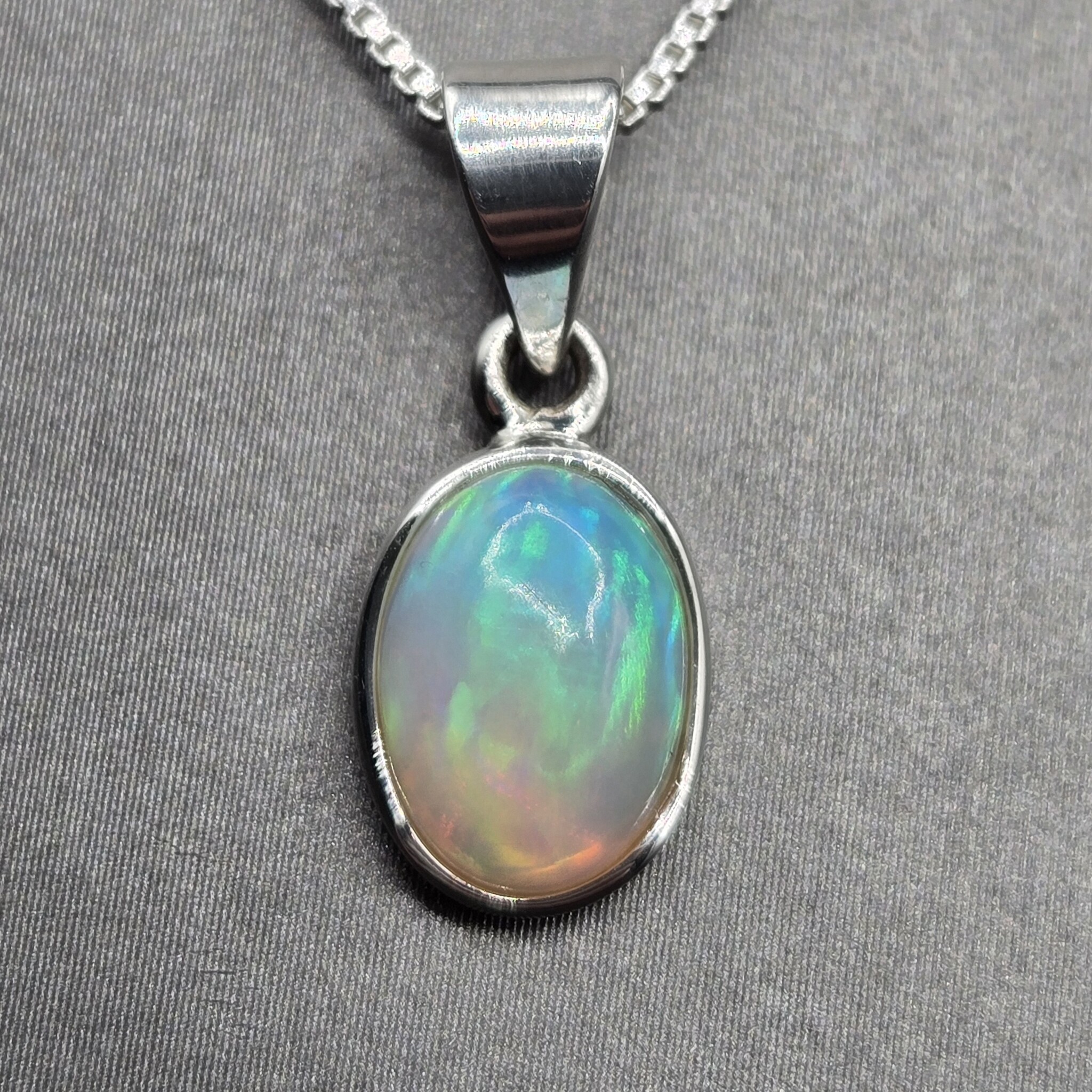 VIT 005 SS Ethiopian Opal 10mm Oval Polished Bezel Set Necklace 18"