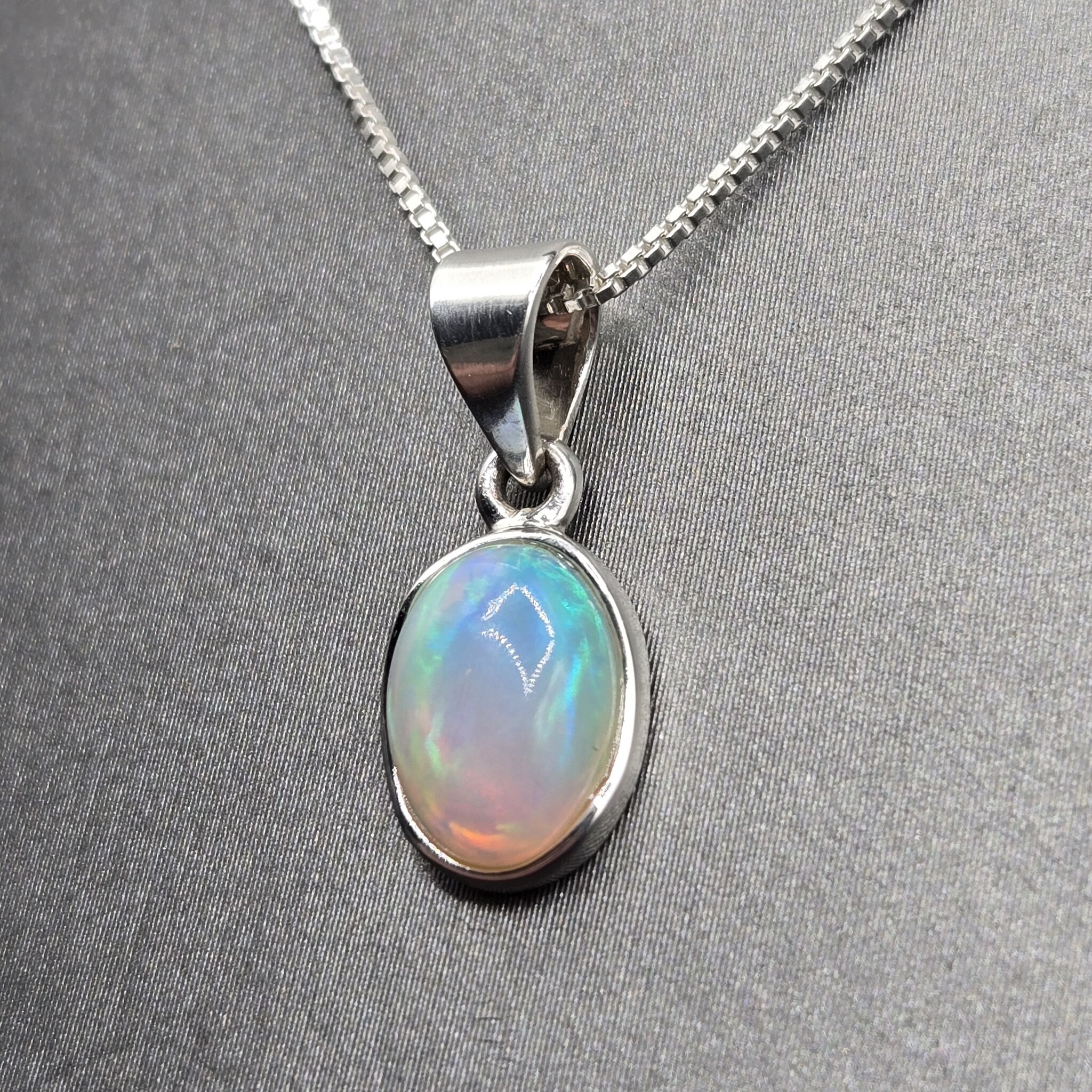 VIT 005 SS Ethiopian Opal 10mm Oval Polished Bezel Set Necklace 18"