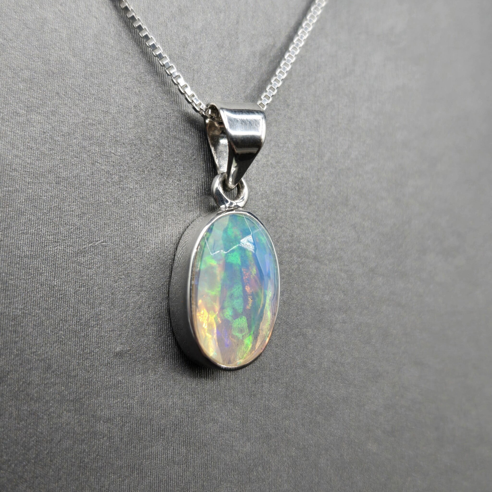 VIT 005 SS Ethiopian Opal Faceted 8x13mm Oval Bezel Set Pendant With Box Chain Necklace, 18"