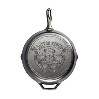 https://cdn.shoplightspeed.com/shops/612885/files/55395743/330x330x1/yellowstone-steer-cast-iron-12-skillet.jpg