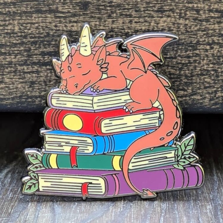 DRAGON SLEEPING ON TOP OF BOOKS PIN