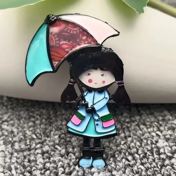 MIO QUEENA GIRL HOLDING UMBRELLA COLORED ENAMEL BROOCH