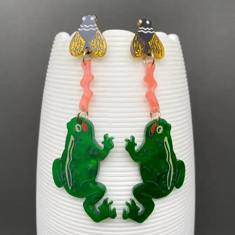 MIO QUEENA FROG EATING FLIES ACRYLIC EARRINGS