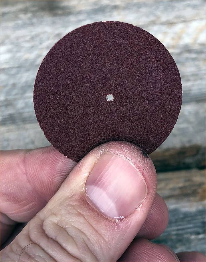 10.01102 = Aluminum Oxide Pinhole Sanding Disc Extra Fine  (320grit) 1-1/2''  (Pkg of 100)