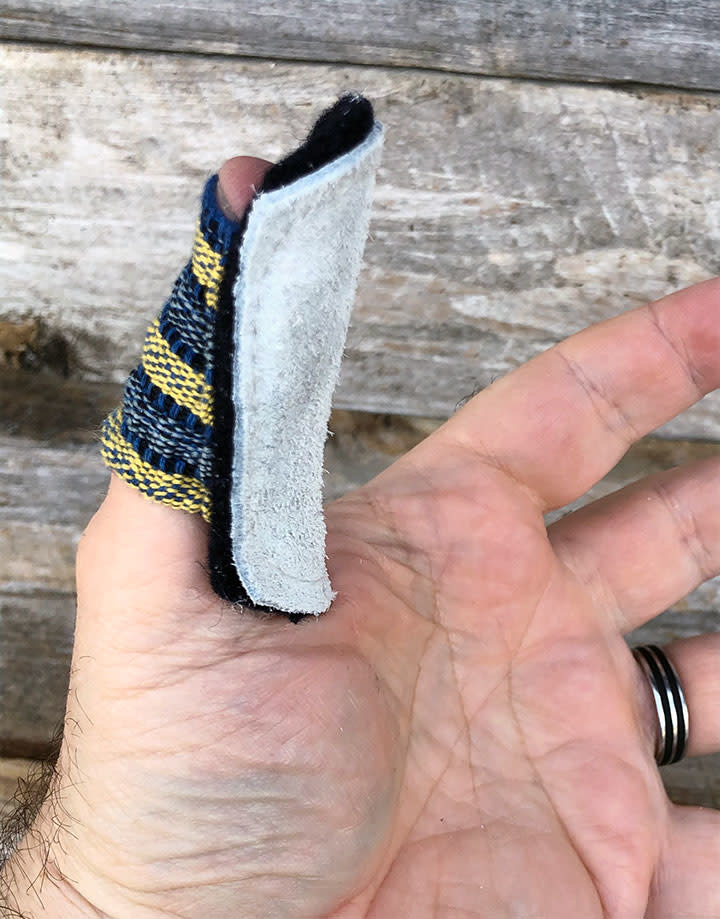 47.531 = FINGER COT LEATHER/WOOL-LINED THUMB GUARD