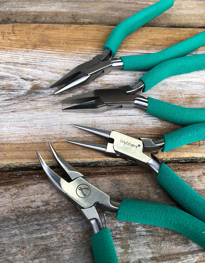 PL6097 = Wubbers Plier Set (4 pcs) with Stand