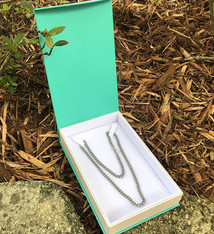 DBX4355 = Deluxe Magnetic Teal/White Necklace Box 4-3/4'' x 7-1/4'' x 1-1/8'' (Each)