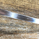 SRBW3 = Bezel Wire Serrated Fine Silver 4.77mm x 28ga  (Sold per foot)