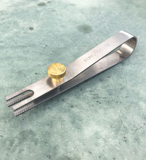 SO2003 = Titanium Bezel Clamp