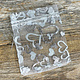 DBX1293HW = Organza Drawstring Pouches White with Silver Hearts 3''x4'' (Pkg/10)