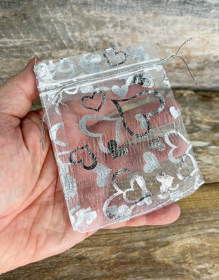 DBX1293HW = Organza Drawstring Pouches White with Silver Hearts 3''x4'' (Pkg/10)