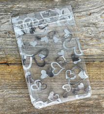 DBX1294HW = Organza Drawstring Pouches White with Silver Hearts 4''x5'' (Pkg/10)