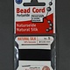 38.01215 = Black Silk Beading Cord #5 on Card with Needle