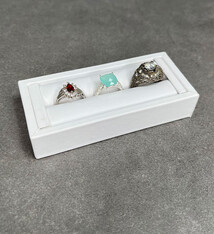 DRG6901 = White Leatherette Ring Slot Display 4-1/8"
