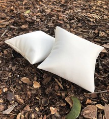 DIS6120 = White Leatherette Pillow for Watches or Bracelets 4''x4'' (Pkg of 5)