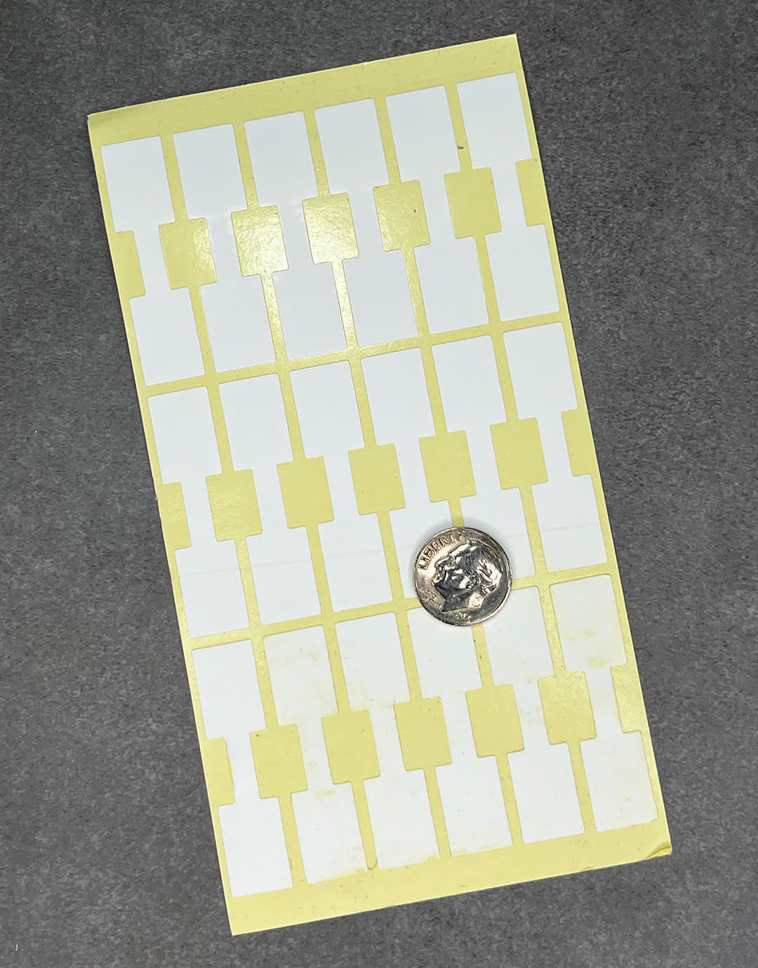 DTA7080 = White Square Dumbbell Tags 1-9/16'' x 7/16'' (Pkg of 1000)