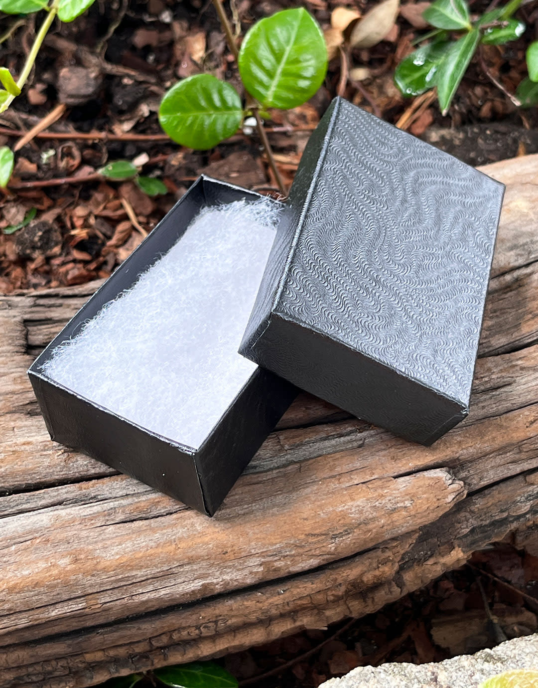 DBX2821B = BOXES - COTTON FILLED BLACK SWIRL  2-5/8'' x 1-1/2'' x 7/8''   CASE 100