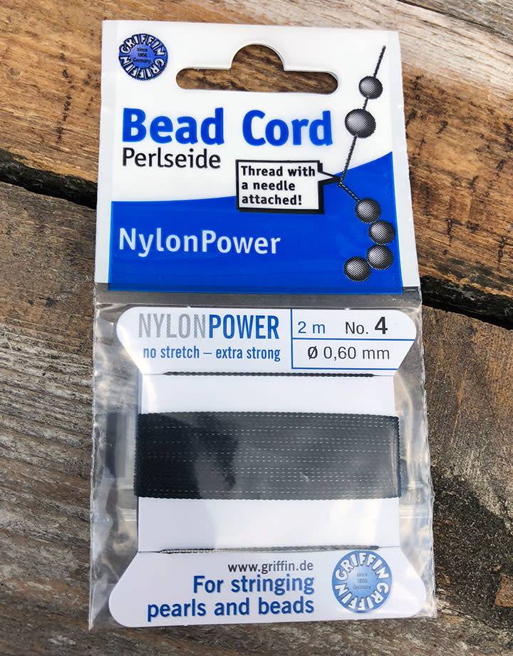 38.0704 = Black Nylon Beading Cord #4 on Card with Needle