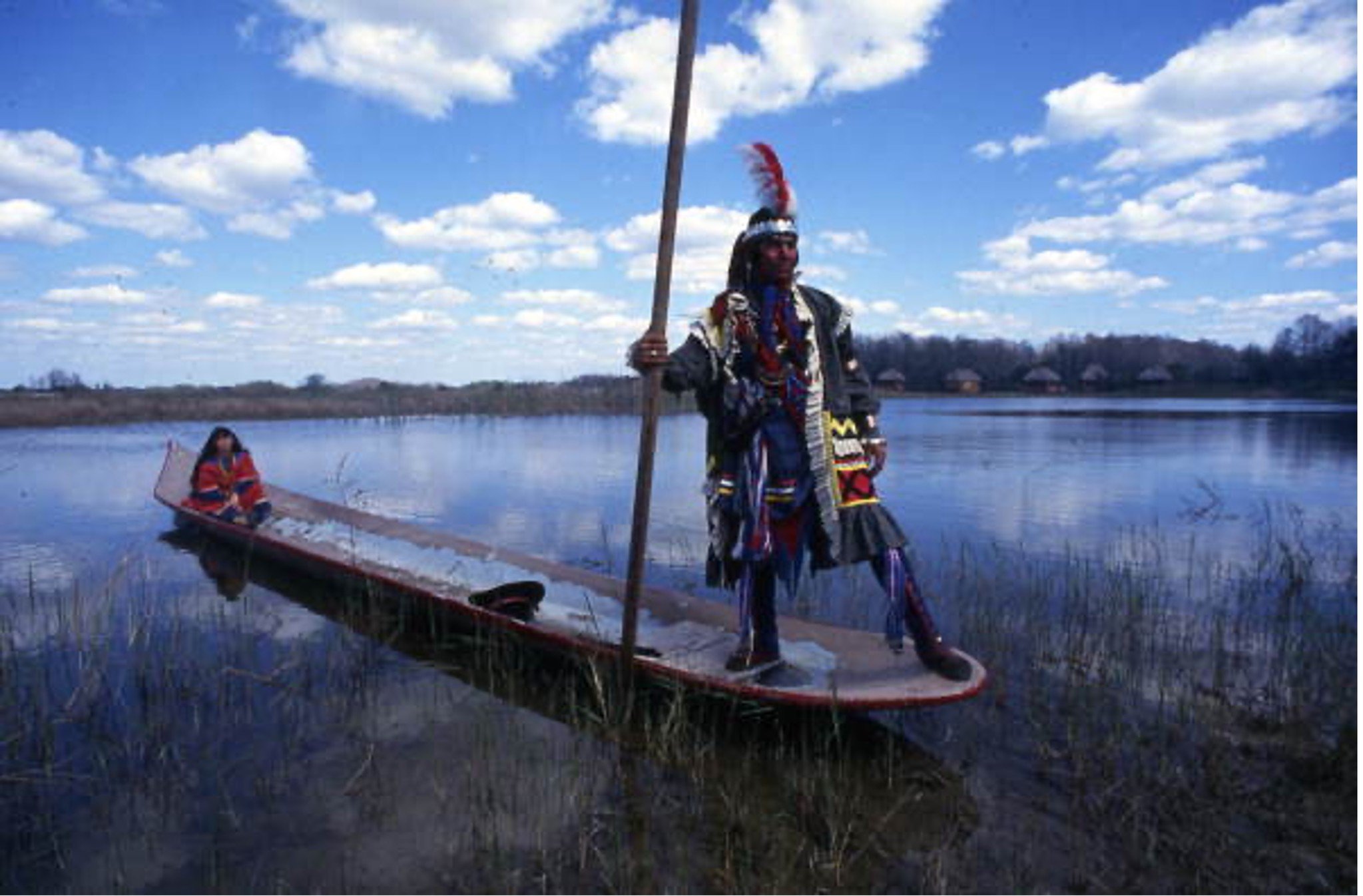 Indian dugout paddle boarder