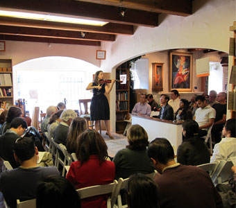 Danielle Belén compares contemporary Cremonese violins at Metzler's on April 10, 2011.