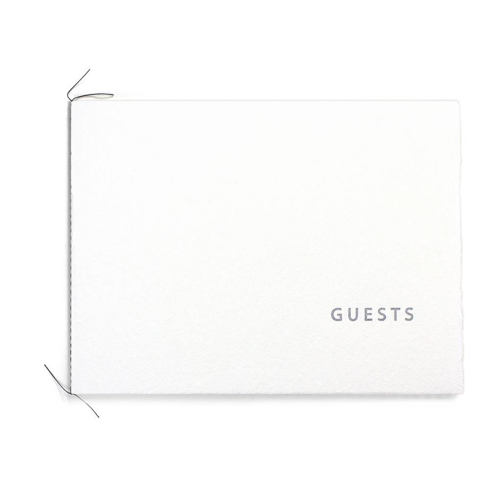 White/silver guest book and Pen