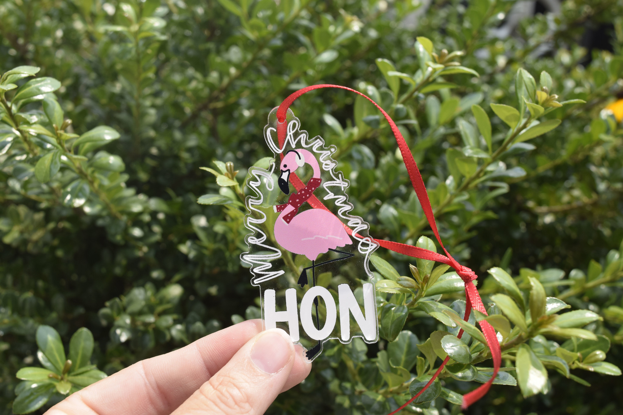 the letters mdn Merry Christmas Hon Flamingo Ornament