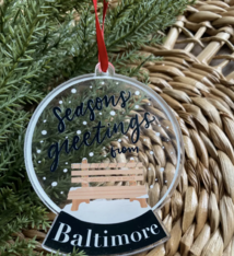 the letters mdn Seasons Greetings Baltimore Snow Globe Acrylic Ornament