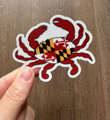 the letters mdn Maryland Flag Crab Sticker