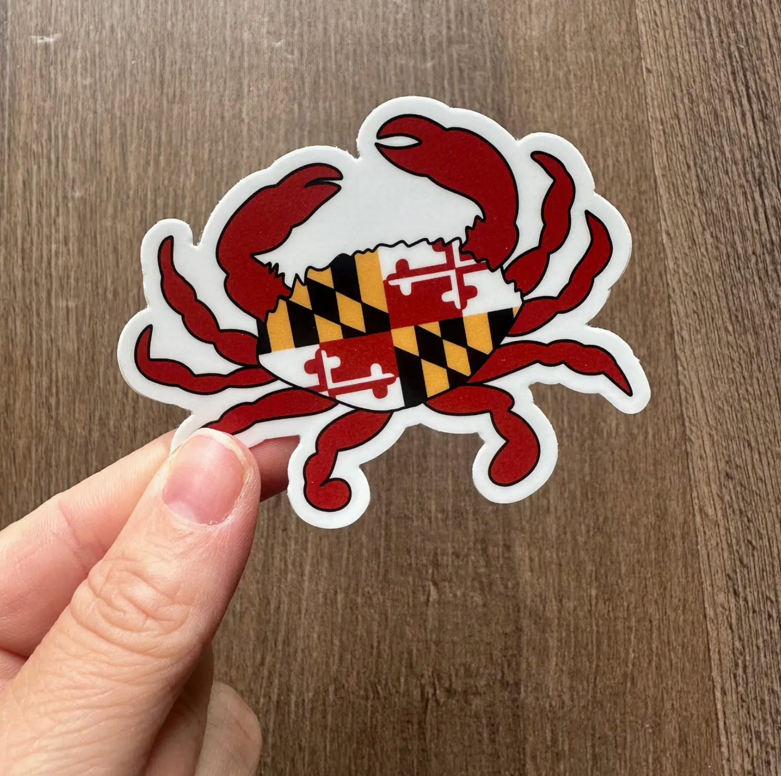 the letters mdn Maryland Flag Crab Sticker