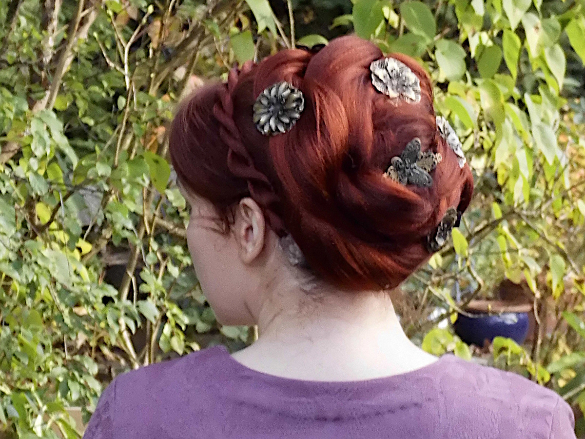 Red Rose Bun Hairstyle for Family Weddings