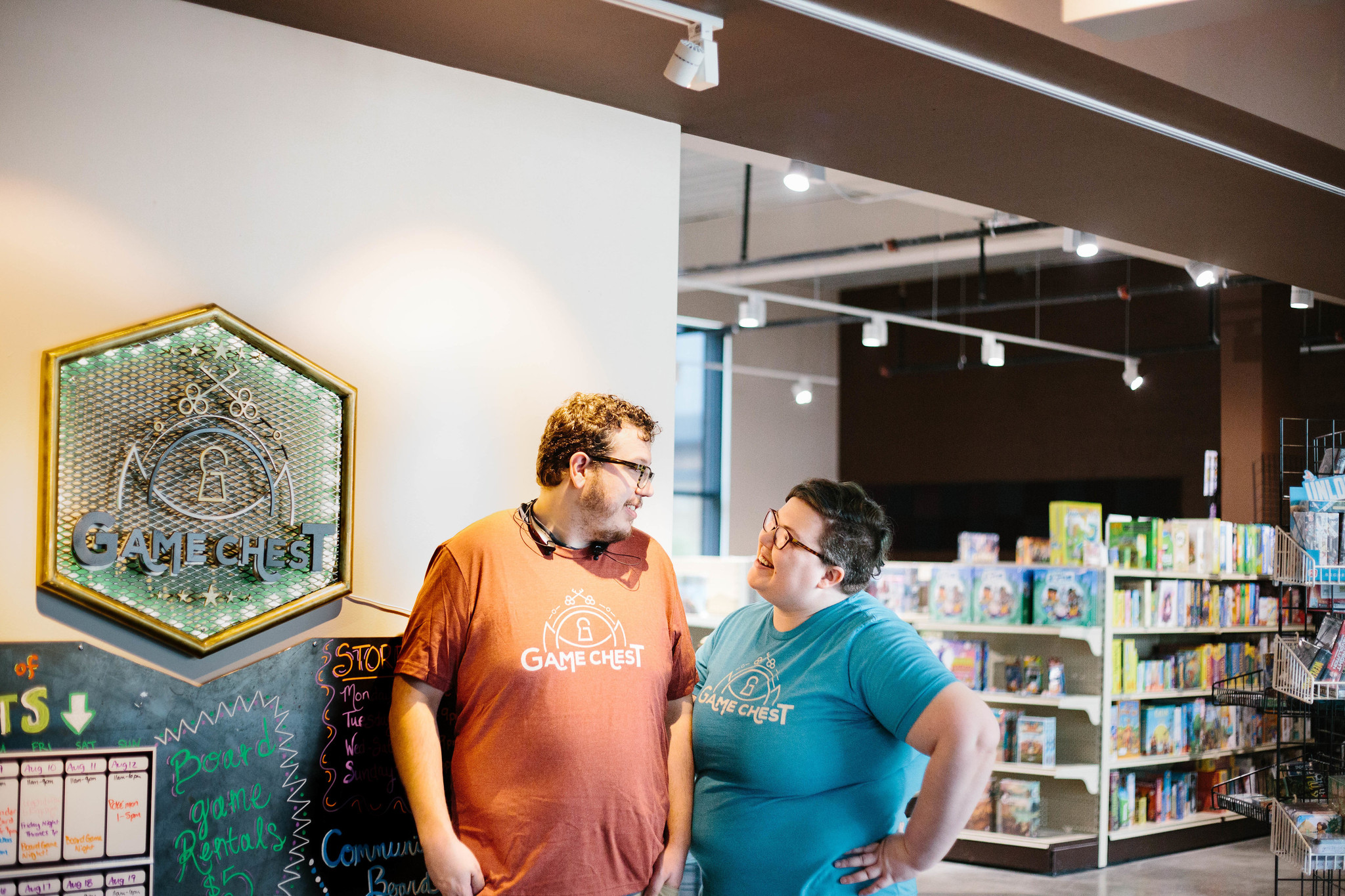 Photo of Ben and Amanda looking at each other in front of the Jones Building location. 